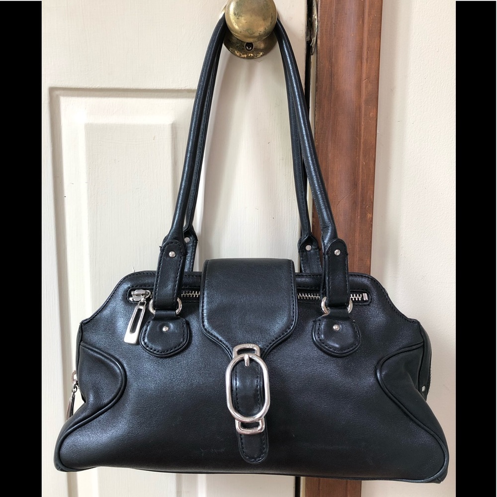Cole Haan black leather purse. Slit pocket on back